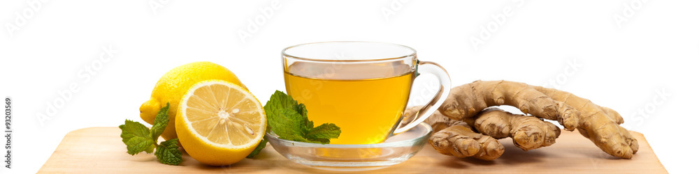 Ginger tea. Ginger, lemon, mint leaves on white background. Selective focus. Ginger tea. Ginger, lemon, mint leaves on white background. Selective focus.