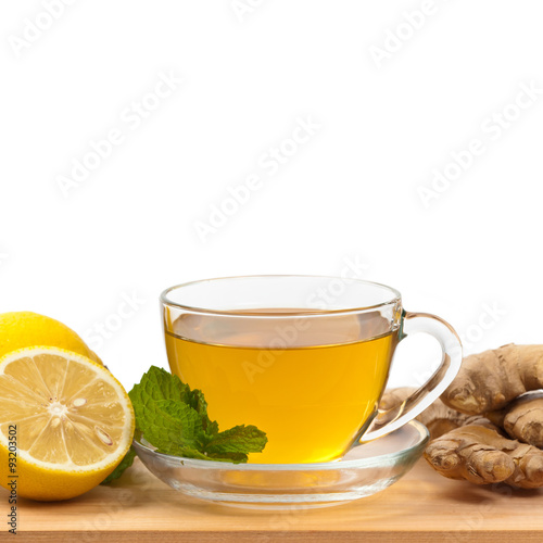 Ginger tea. Ginger, lemon, mint leaves on white background. Selective focus.