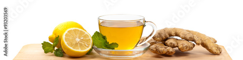 Ginger tea. Ginger, lemon, mint leaves on white background. Selective focus. © Ali Safarov
