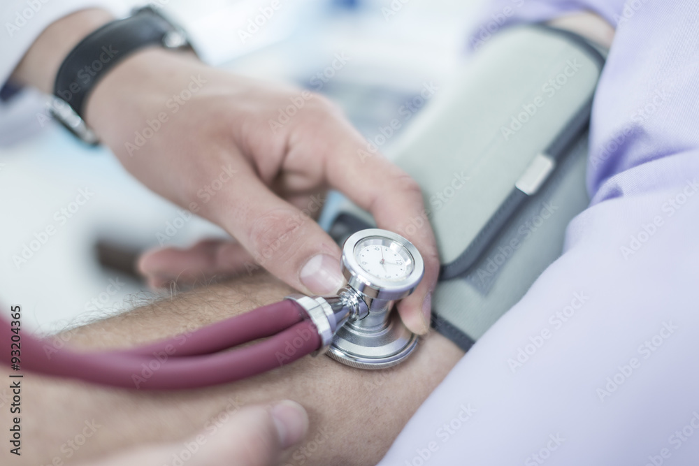 Doctor measuring blood pressure Doctor measuring blood pressure
