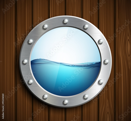 Round porthole on a wooden surface.