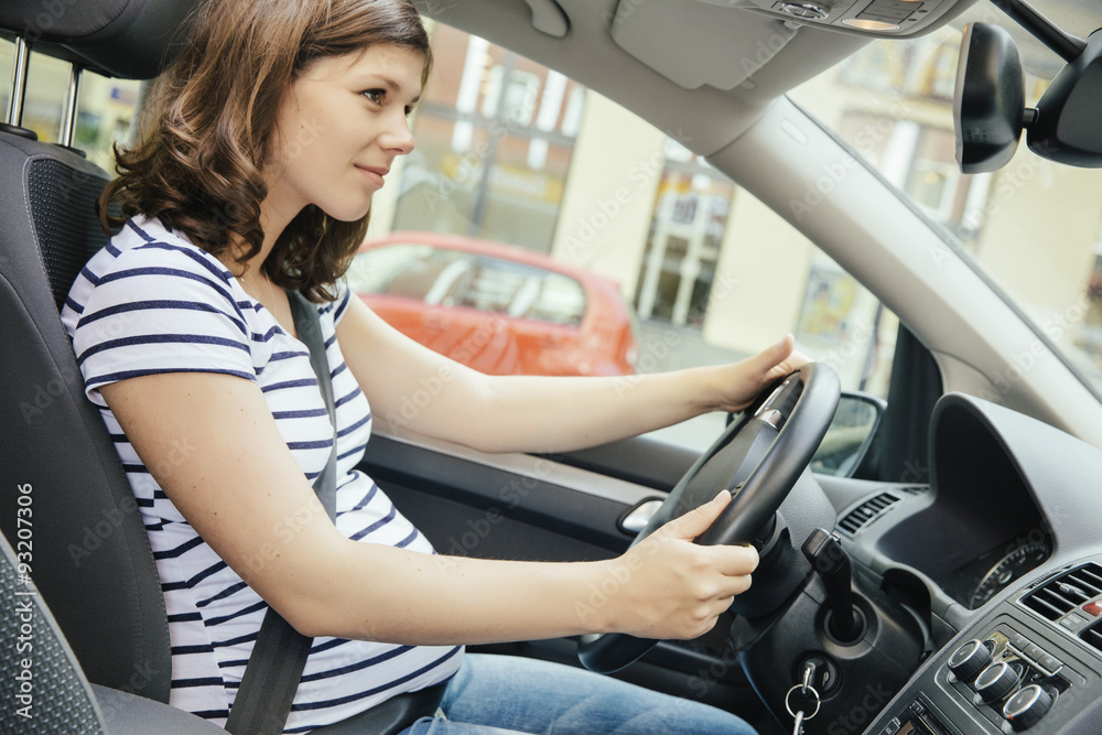 Pregnant woman driving car Pregnant woman driving car