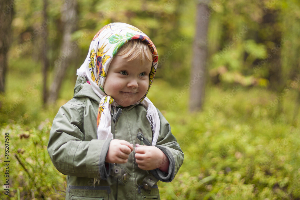 child in a kerchief at the forest child in a kerchief at the forest