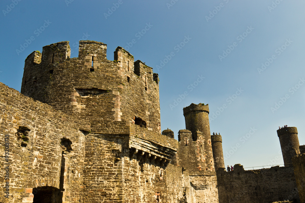 Castle fortress with towers and walls in ruins
