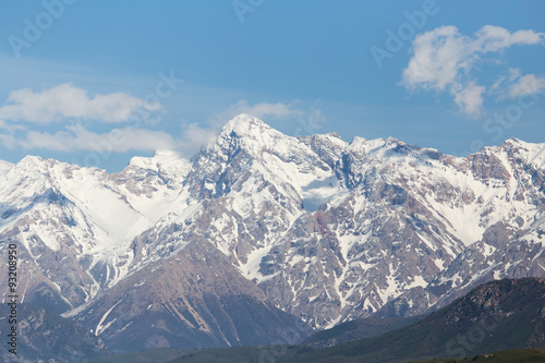 the snowy peaks of the Tien Shan Mountains. Kazakhstan © schankz