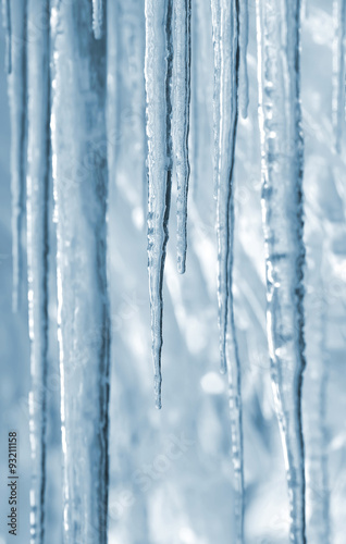 Background of bright transparent icicles in the sunlight