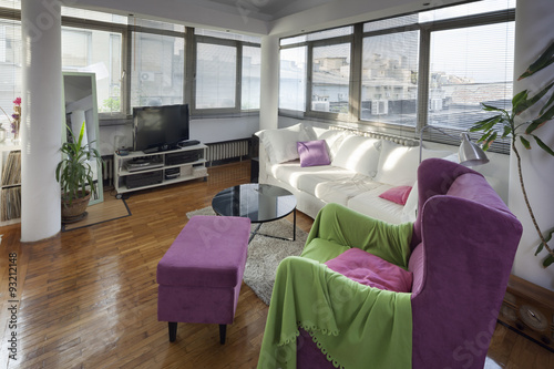 violet armchair in modern apartmet interior