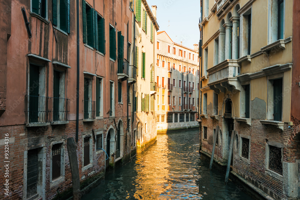 Narrow canal among old  houses, Venice, Italy.