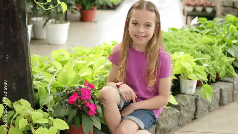 Pretty girl holding a flower pot Pretty girl holding a flower pot