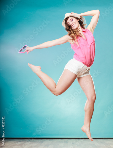 Summer woman in straw hat jumping © Voyagerix