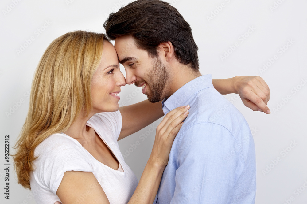 Portrait of loving couple in front of white background Portrait of loving couple in front of white background