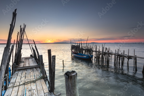 End of day with a relax sunset at an old pier