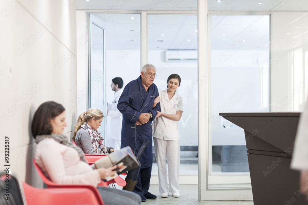 Nurse supporting patient in waiting area Nurse supporting patient in waiting area