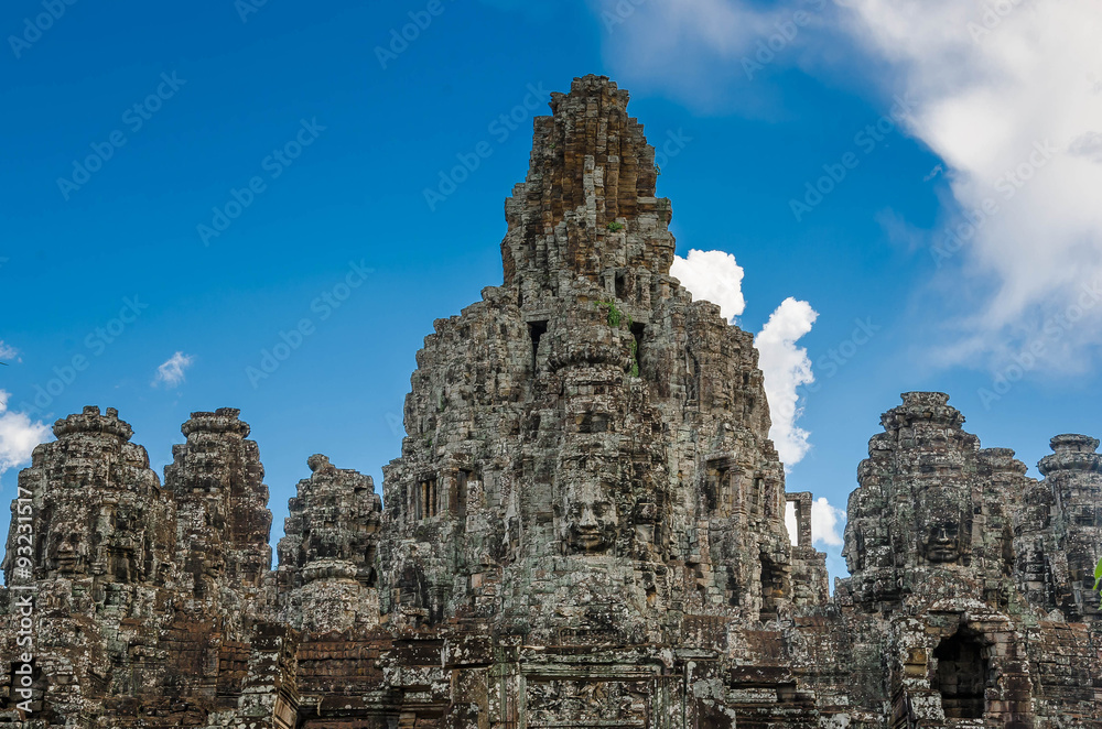 Ancient stone faces Bayon temple in Angkor Thom, Siemreap, Cambo