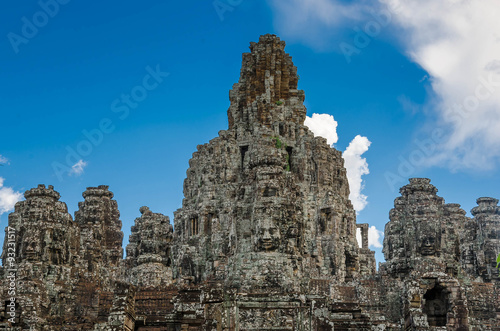 Ancient stone faces Bayon temple in Angkor Thom  Siemreap  Cambo