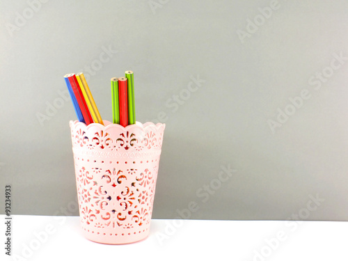 colorful holder full of pen and pencil office equipment for eduation or business still life