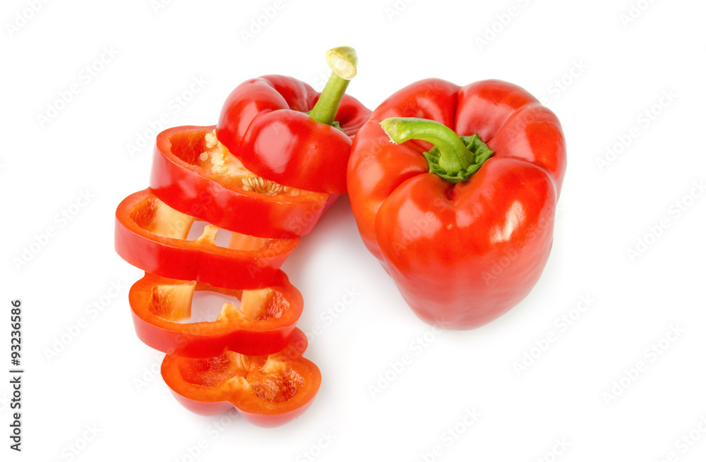 fresh red bell pepper (capsicum) and a cut one on a white background fresh red bell pepper (capsicum) and a cut one on a white background