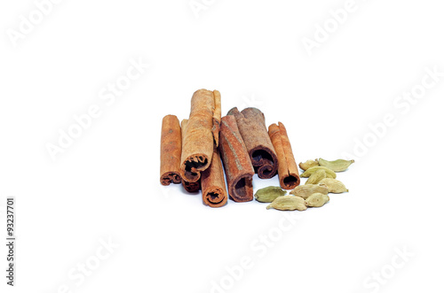 Cinnamon sticks and cardamom isolated on white background