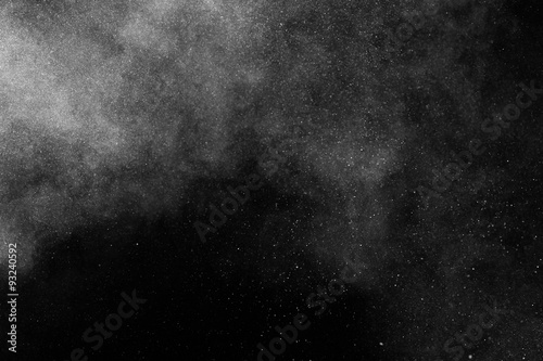 abstract white dust explosion on a black background. abstract white powder. design elements. abstract texture.