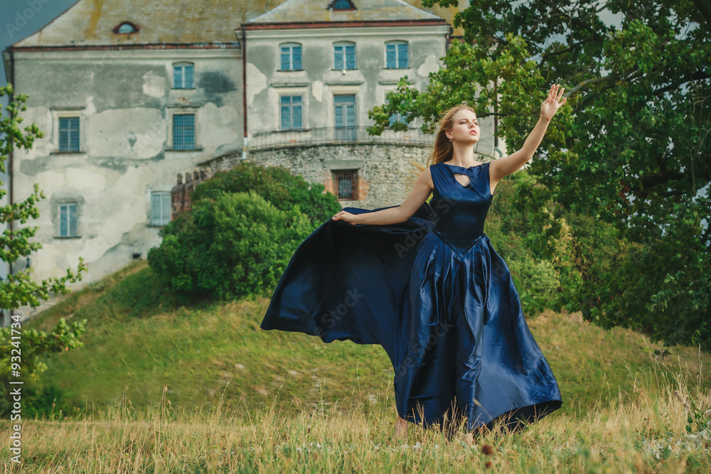 Beautiful young woman in blue dress