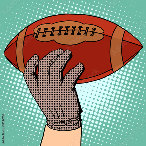 The ball of American football in his hand