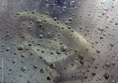 Rain drops on frot car window. photo