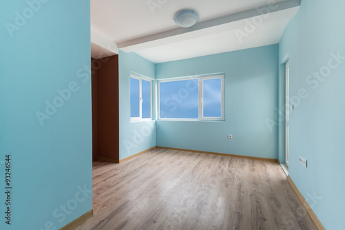 Empty blue room with windows and a door  includes clipping path 