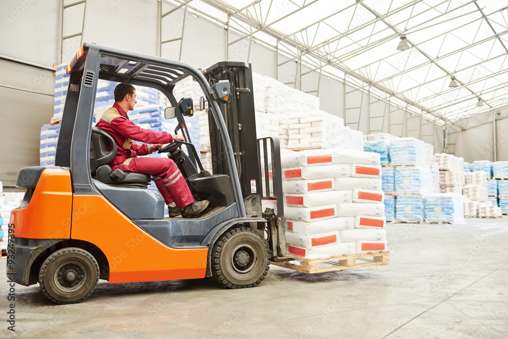 forklift loader working in warehouse forklift loader working in warehouse