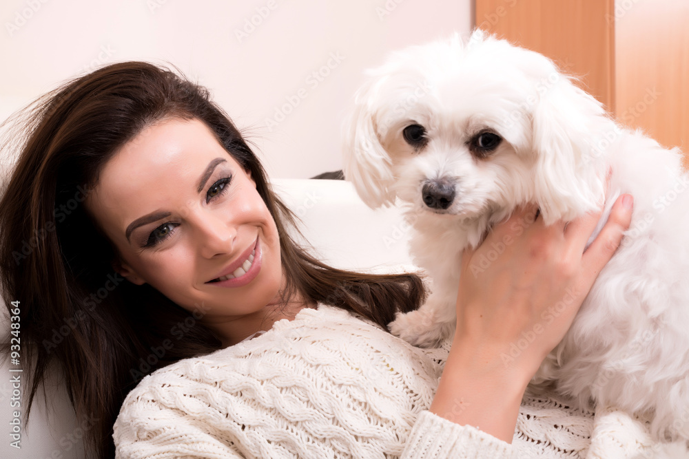 Young beautiful woman hugging her puppy Young beautiful woman hugging her puppy