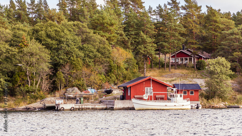 Red cottages and fishing boat in south Sweden