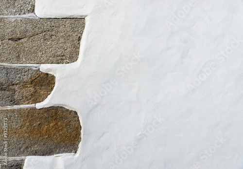 White wall with a stone left corner