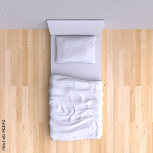 Bed with pillow and blanket in the corner room