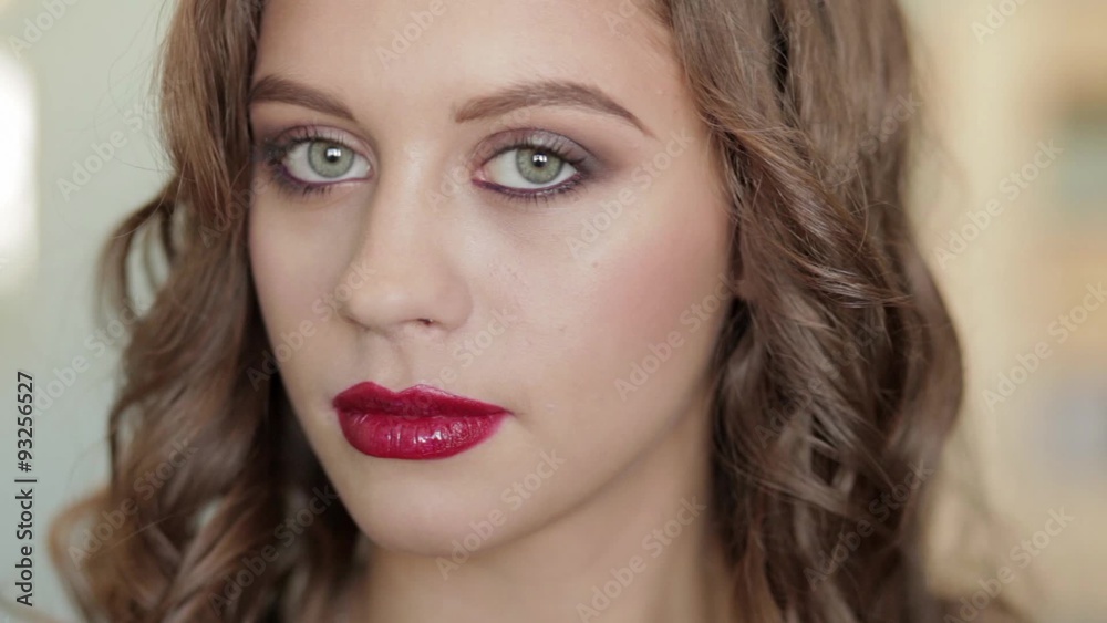 Young beautiful brunette woman shows gorgeous makeup Young beautiful brunette woman shows gorgeous makeup