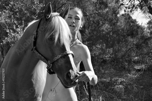 Pretty nude woman and horse 