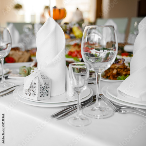 Banquet wedding table with dishware.
