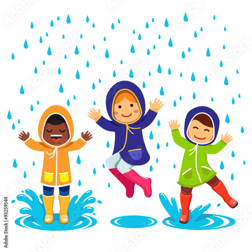 Kids in raincoats and rubber boots playing