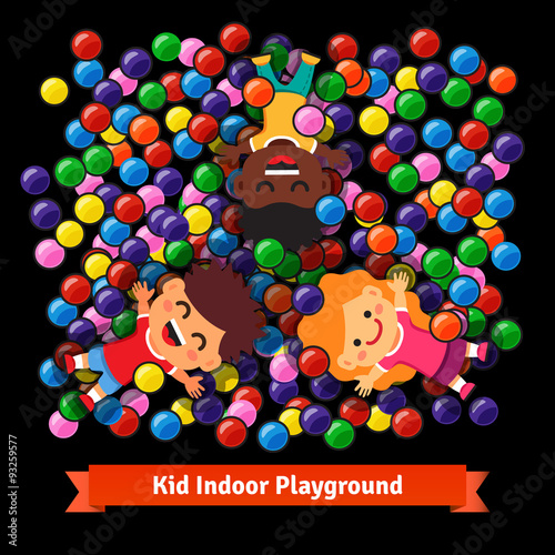 Kids playing at the indoor pool of plastic balls