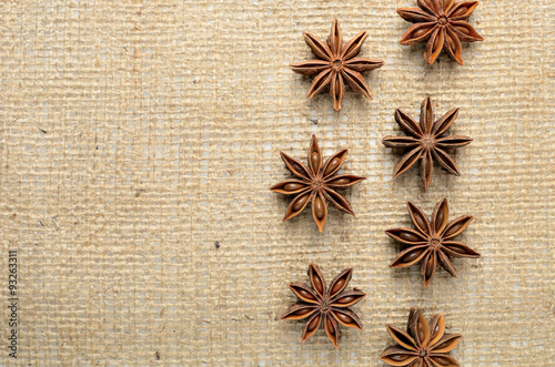 Star anise spices on burlap background