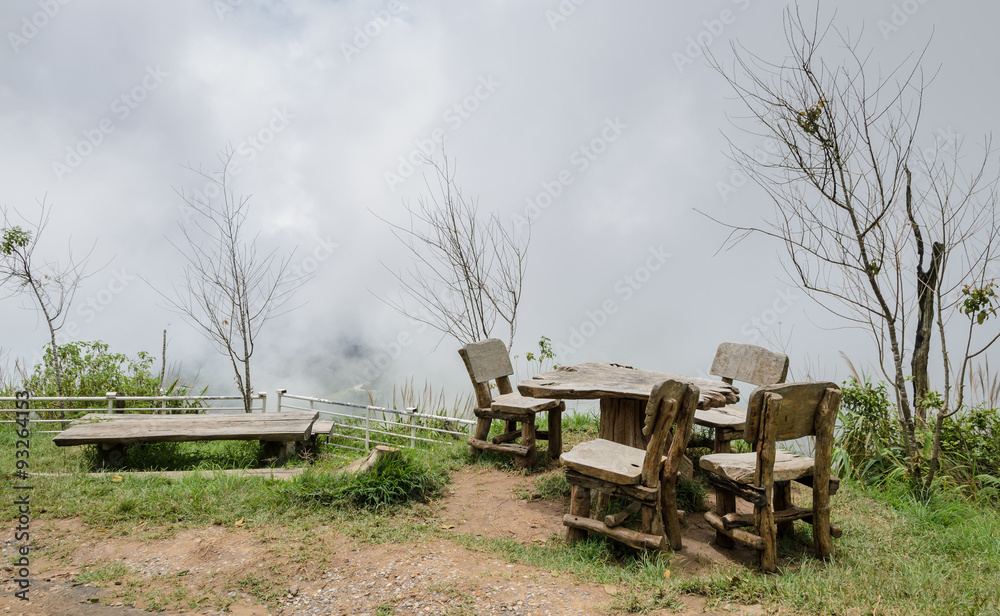 Outdoor table and chairs in foggy morning