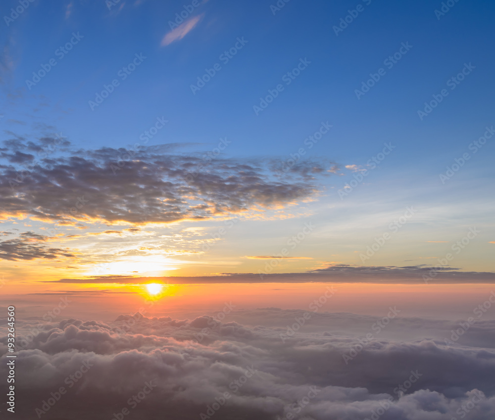 Rising sun in the early morning over sea of mist