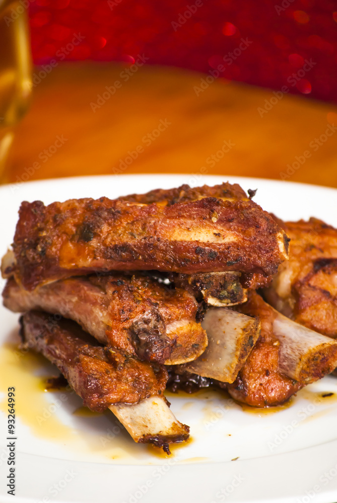 Roasted pork ribs on a white plate Roasted pork ribs on a white plate