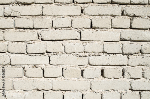 Wall of old white brick closeup