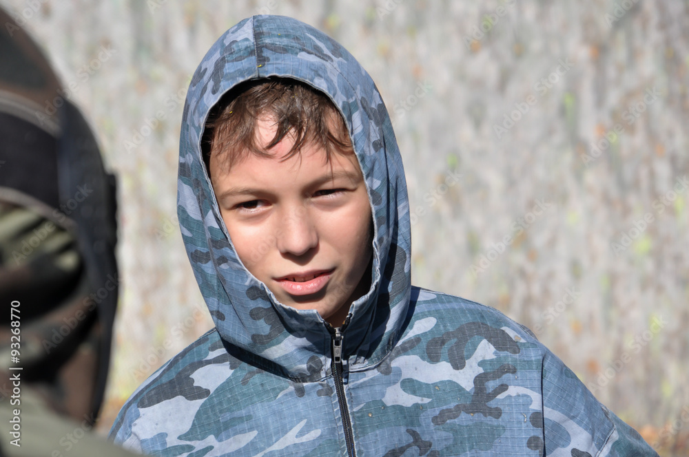 Paintball player in camouflage outdoors Paintball player in camouflage outdoors