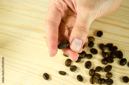 Coffee bean in hand photo