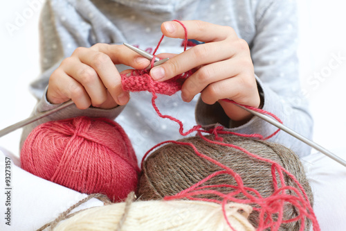 Little child learns to knit. Lifestyle - childhood