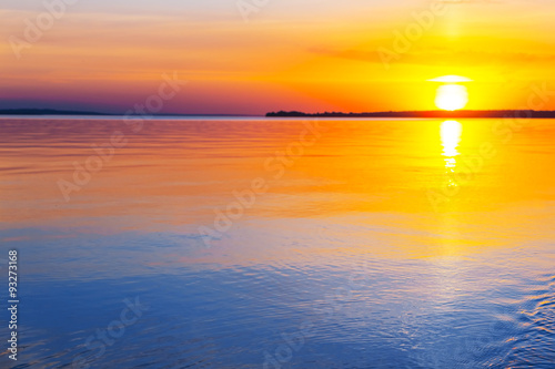 sunset over a lake © Yuriy Kulik