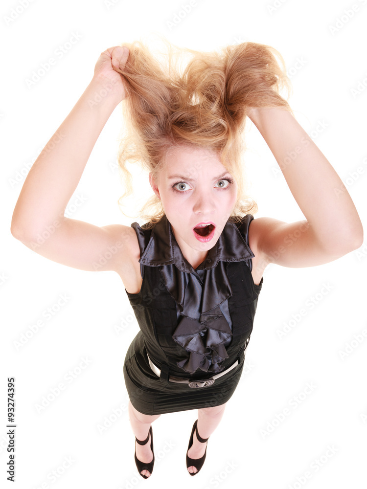Angry furious woman screaming and pulling messy hair Angry furious woman screaming and pulling messy hair