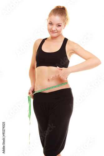 diet. slim blonde girl with measure tape measuring waist © Voyagerix