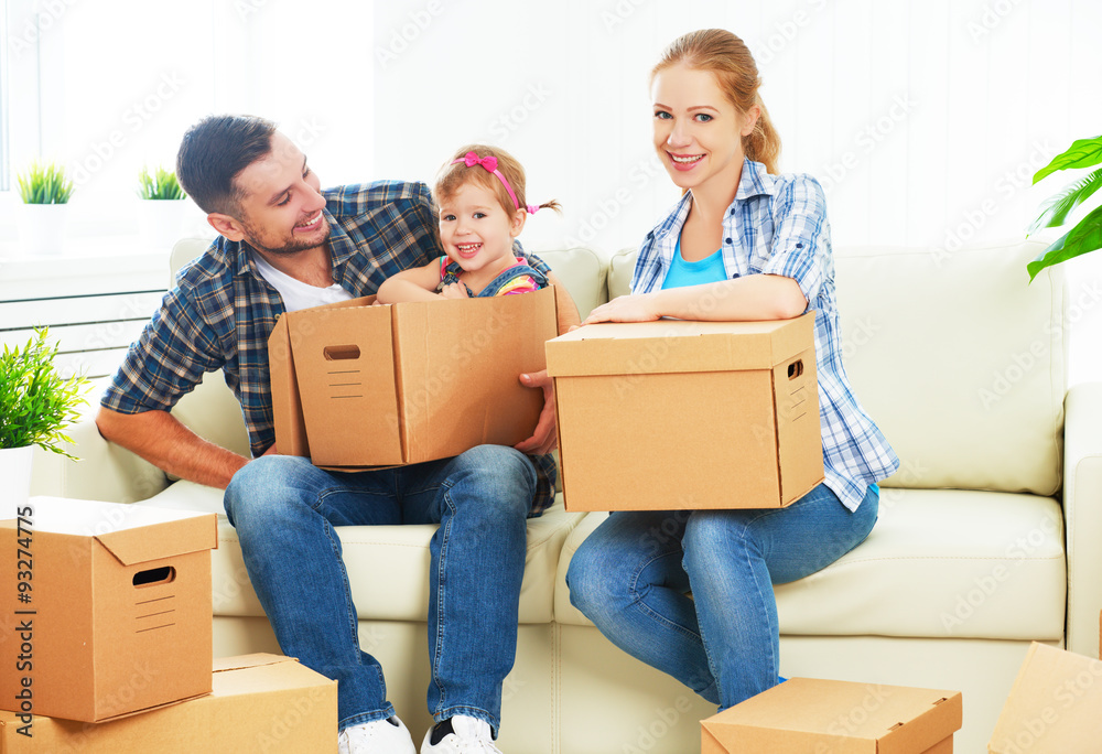 moving to new home. Happy family with cardboard boxes moving to new home. Happy family with cardboard boxes