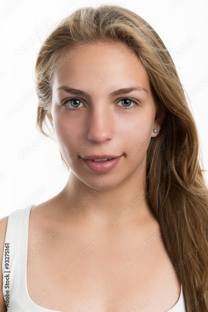 Portrait of a pretty blonde teen girl on a light background. Portrait of a pretty blonde teen girl on a light background.